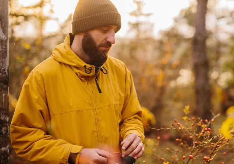 pensive man walking in woods