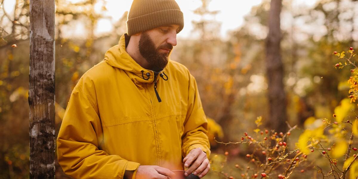 pensive man walking in woods