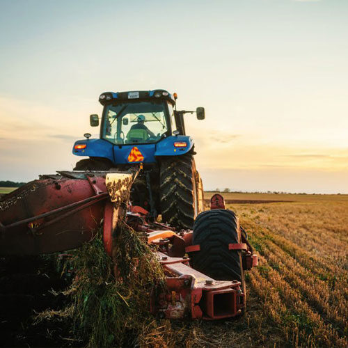 tractor preparing field with seedbed cultivator